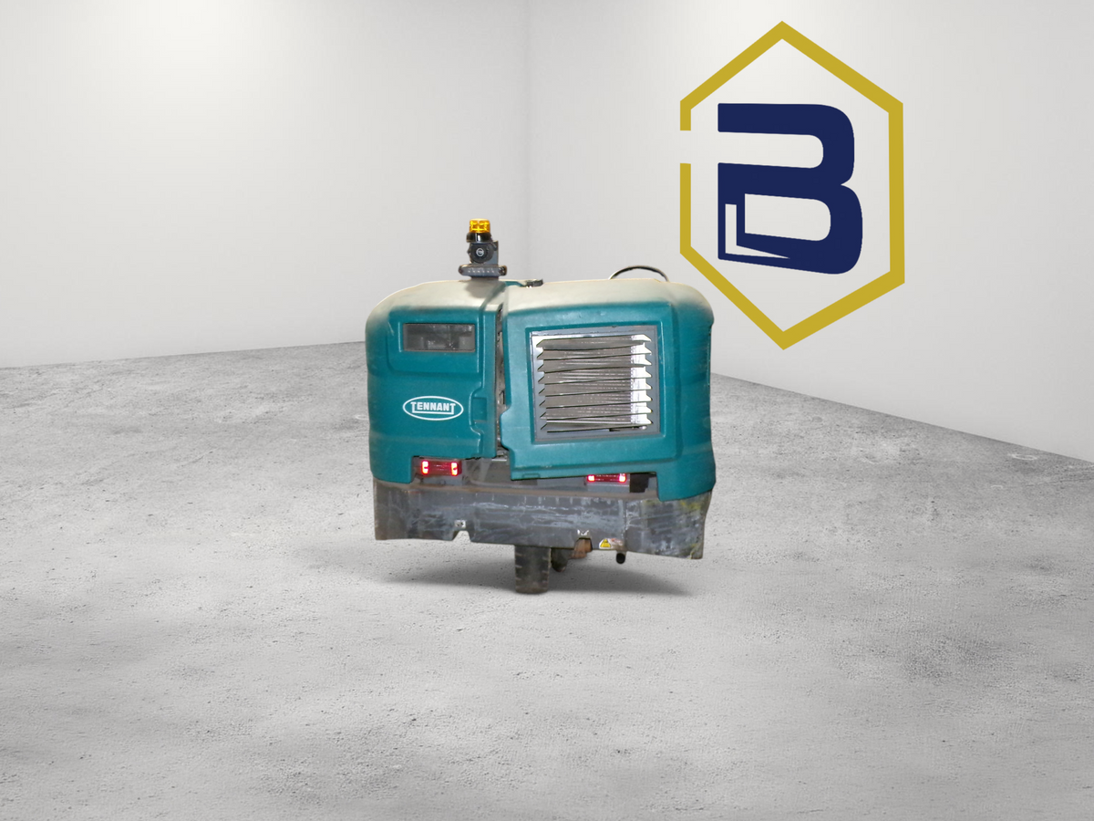 Burwell Material Handling 2000 Tennant S30 industrial rider sweeper in teal, parked in a warehouse facility.