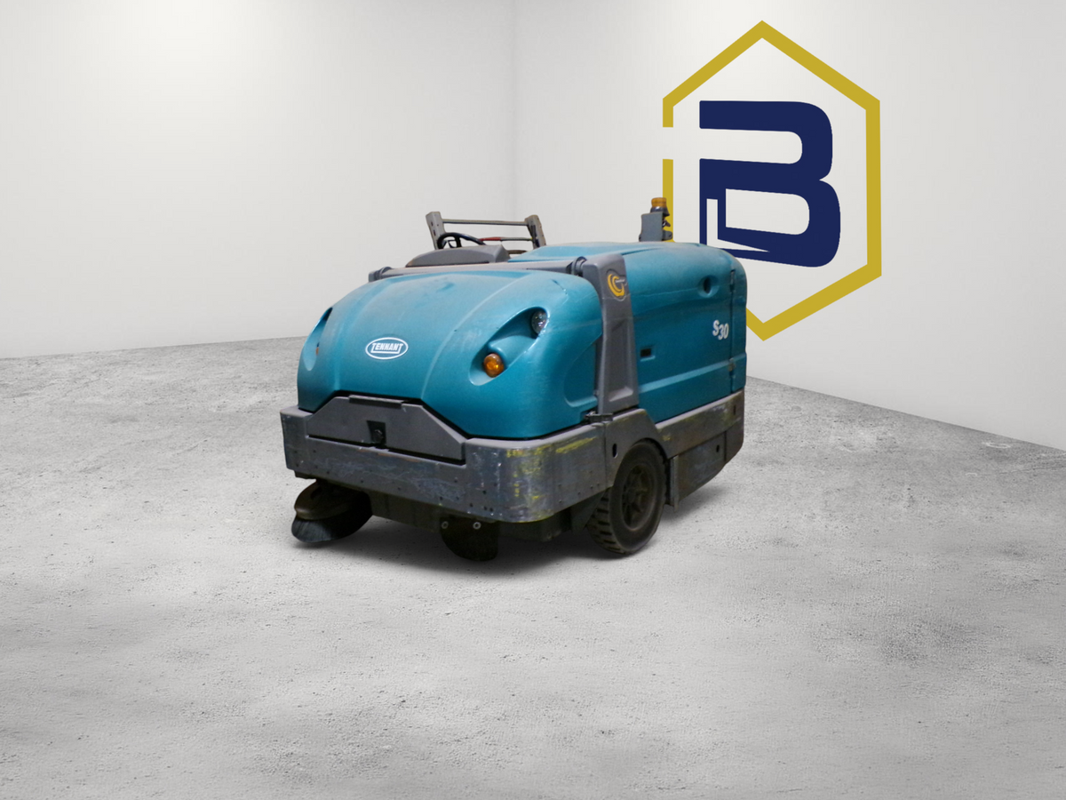 Burwell Material Handling 2000 Tennant S30 mid-size industrial rider sweeper in teal parked in a warehouse.