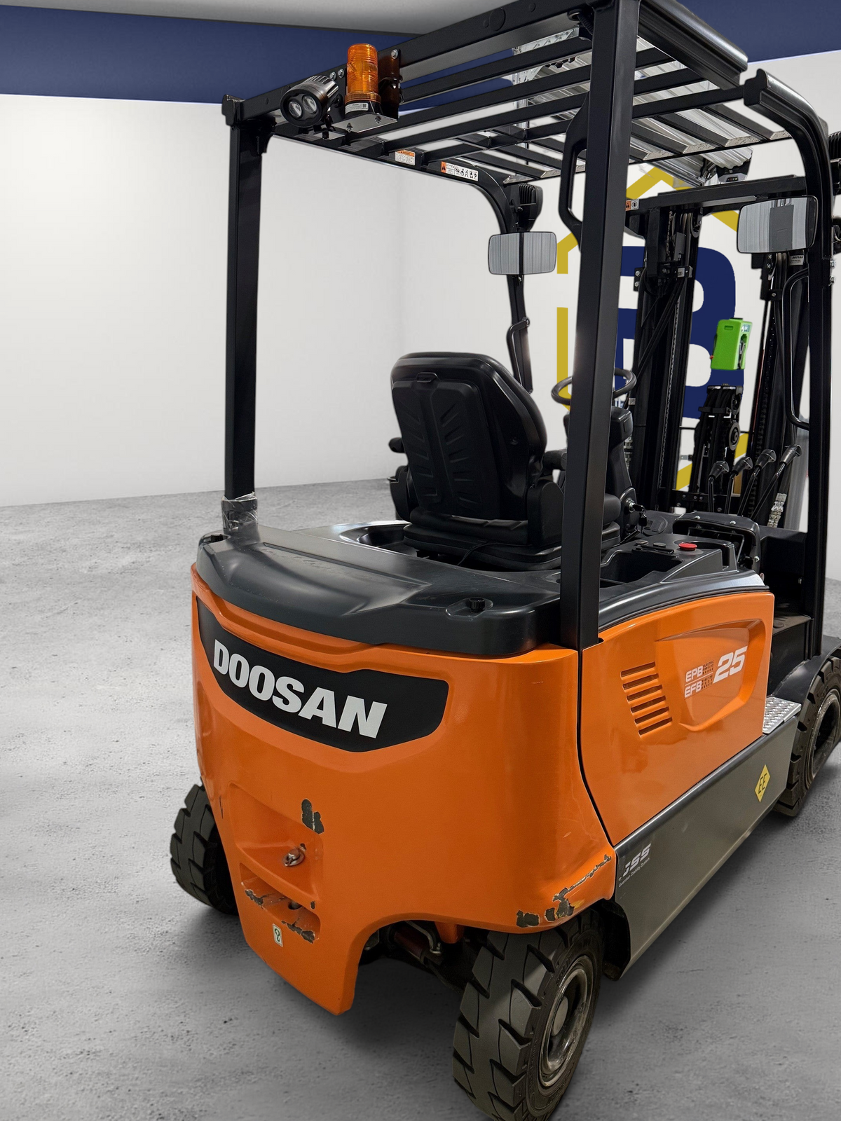Burwell Material Handling 2022 Doosan B25X-7 electric sit-down forklift in orange and black for warehouse use