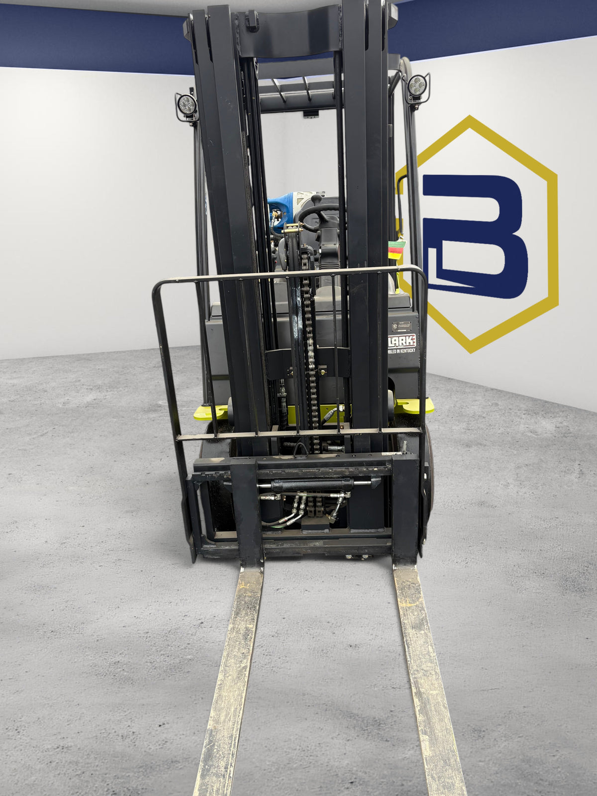 Burwell Material Handling 2022 CLARK S25C cushion-tire forklift with black mast and forks in an outdoor lot