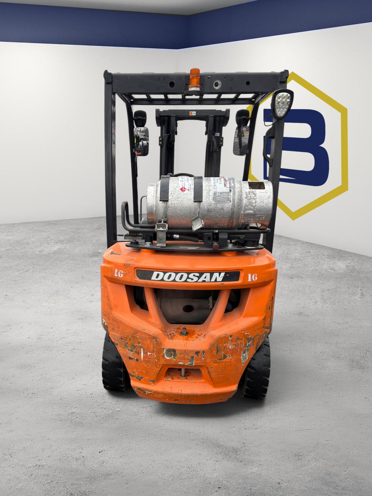 Burwell Material Handling used Doosan G25N-7 LPG pneumatic forklift in orange, viewed from the rear in a parking lot.