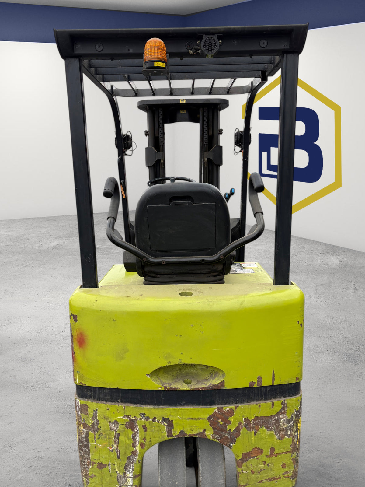 Burwell Material Handling 2007 Clark TMX25 electric sit-down forklift showing the operator seat and overhead guard