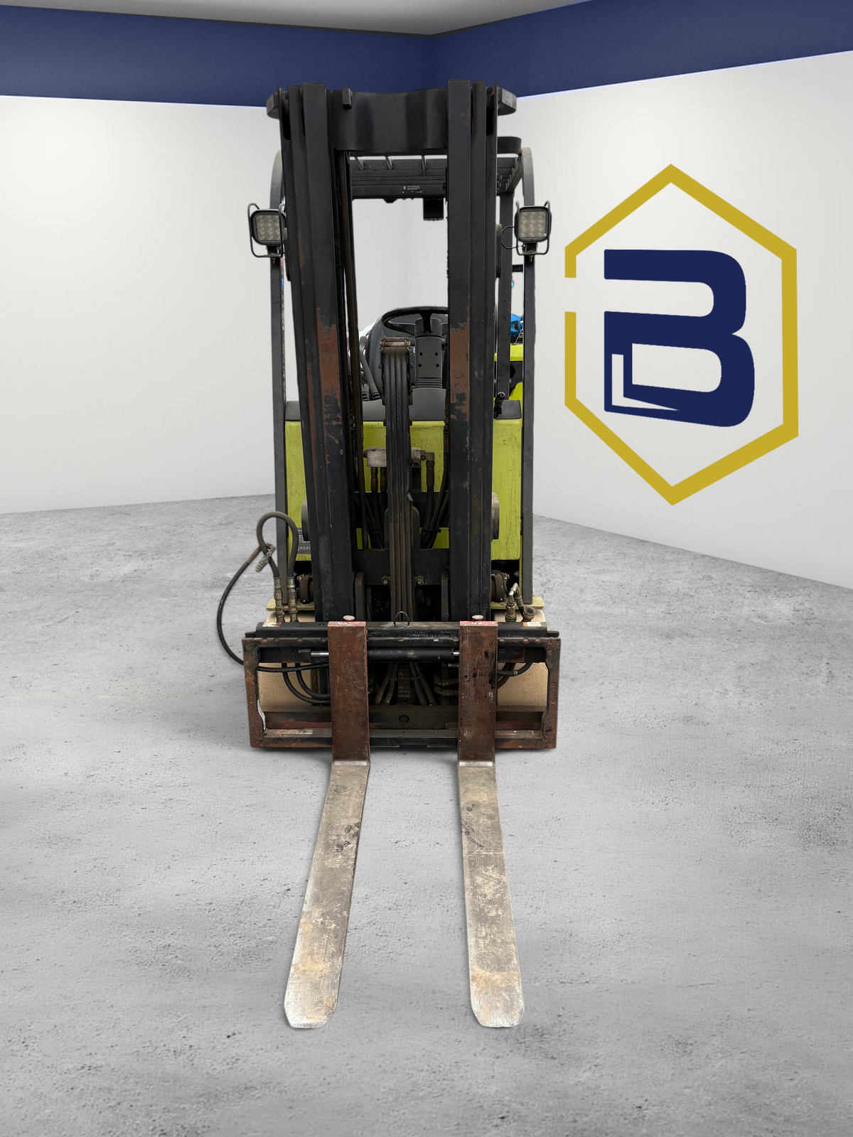 Burwell Material Handling 2007 Clark TMX25 electric sit-down forklift with cushion tires in an outdoor warehouse lot