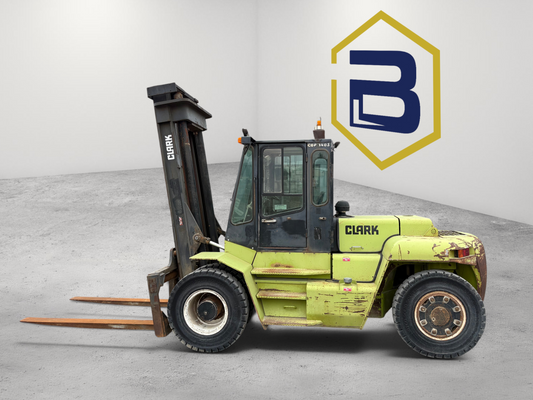 Burwell Material Handling 2000 Clark CDP140S diesel pneumatic forklift parked outside a warehouse facility.