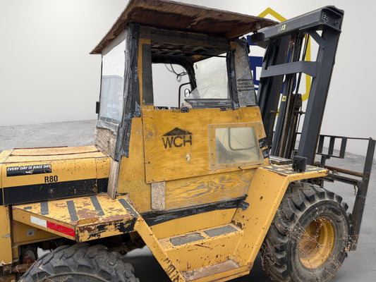 Burwell Material Handling Eagle Picher R80 rough terrain forklift with yellow frame and custom wooden cab enclosure
