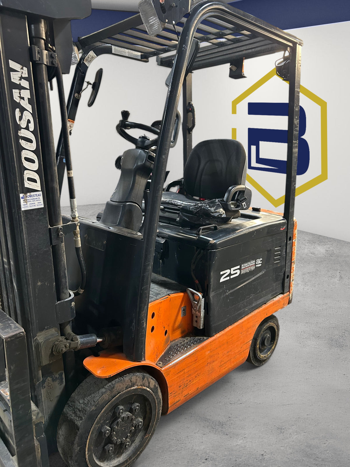 Burwell Material Handling 2000 Doosan BC25S-5 electric cushion forklift with orange and black chassis