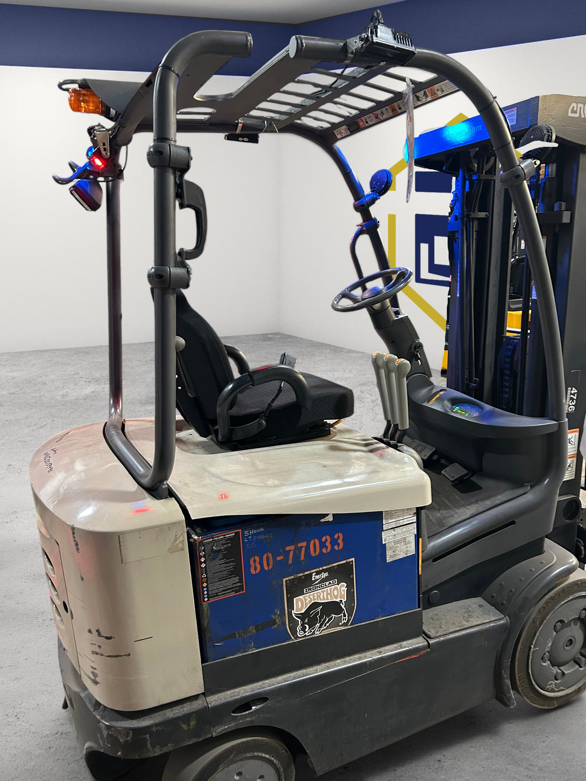 Burwell Material Handling 2021 Crown FC5215-50 electric sit-down forklift with cushion tires in a warehouse setting.