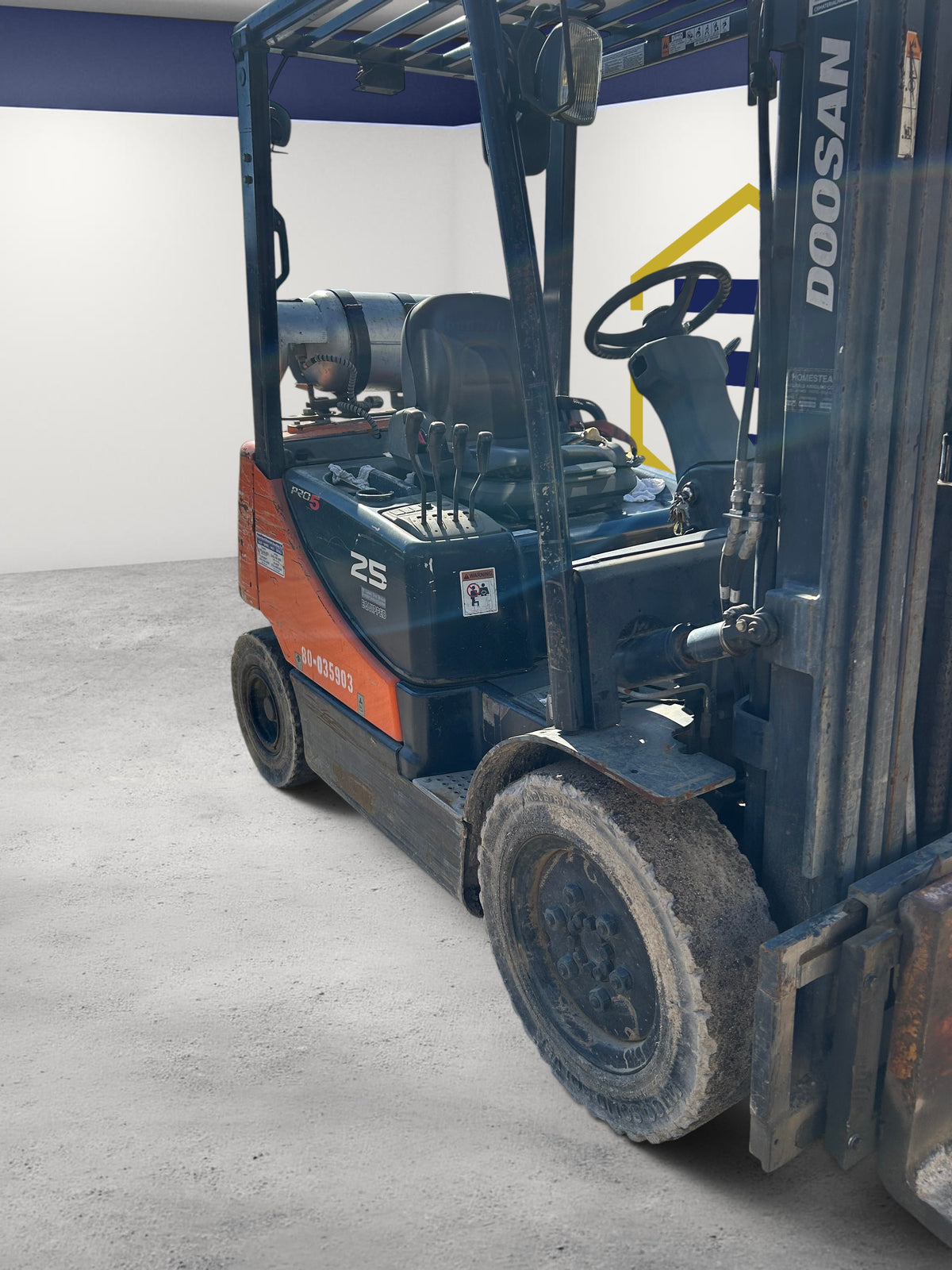 Burwell Material Handling 2016 Doosan G25E-5LP LPG pneumatic tire forklift parked on a gravel yard