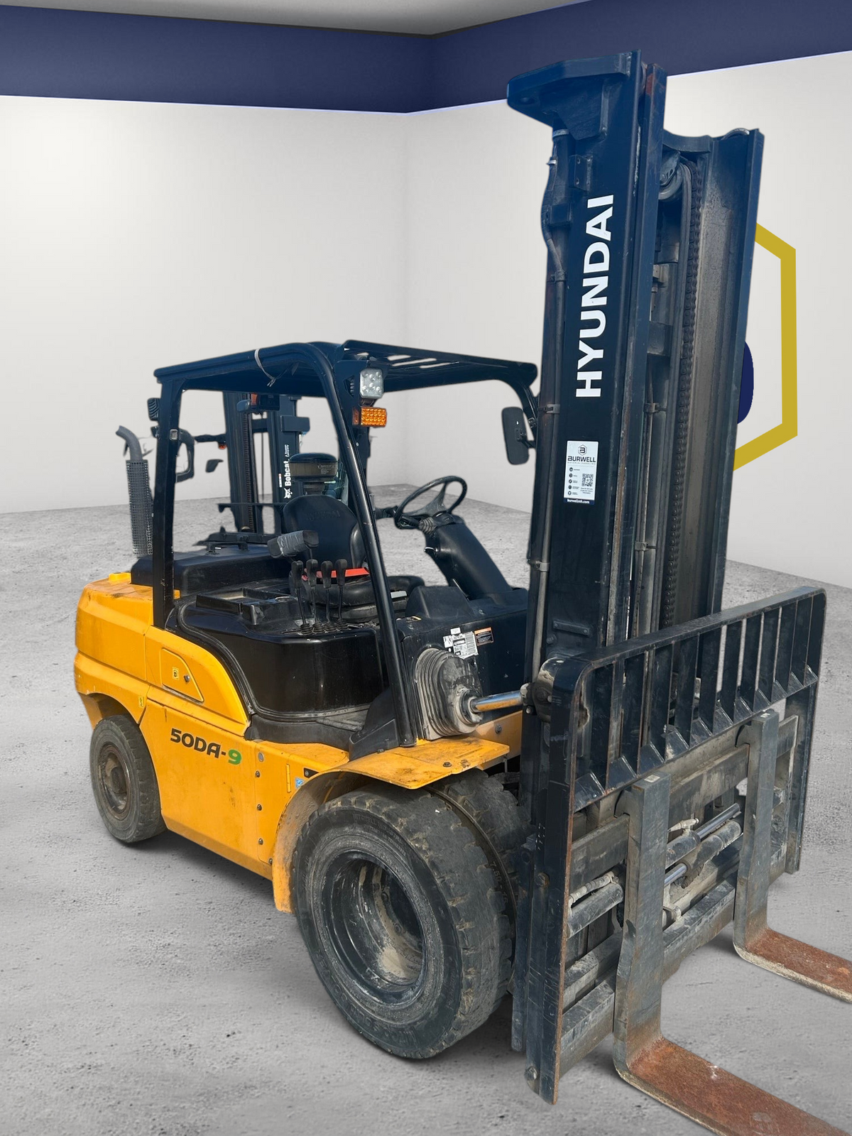 Burwell Material Handling 2021 Hyundai 50DA-9 diesel forklift with pneumatic tires parked on a gravel lot.