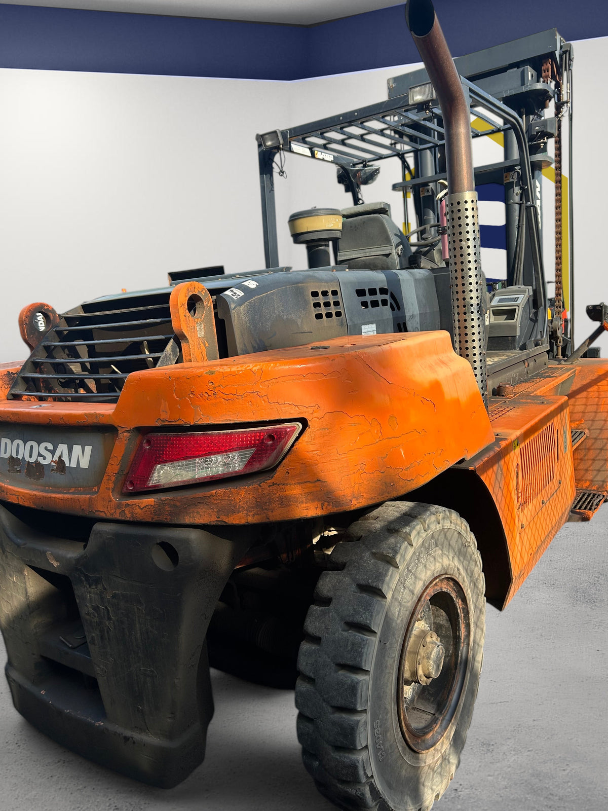 Burwell Material Handling used orange Doosan D140S-7 diesel forklift with heavy-duty chassis and vertical exhaust stack
