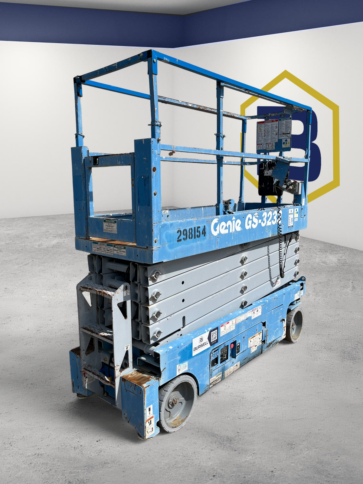 Burwell Material Handling 2013 Genie GS-3232 electric scissor lift with blue chassis and 32-foot platform height.