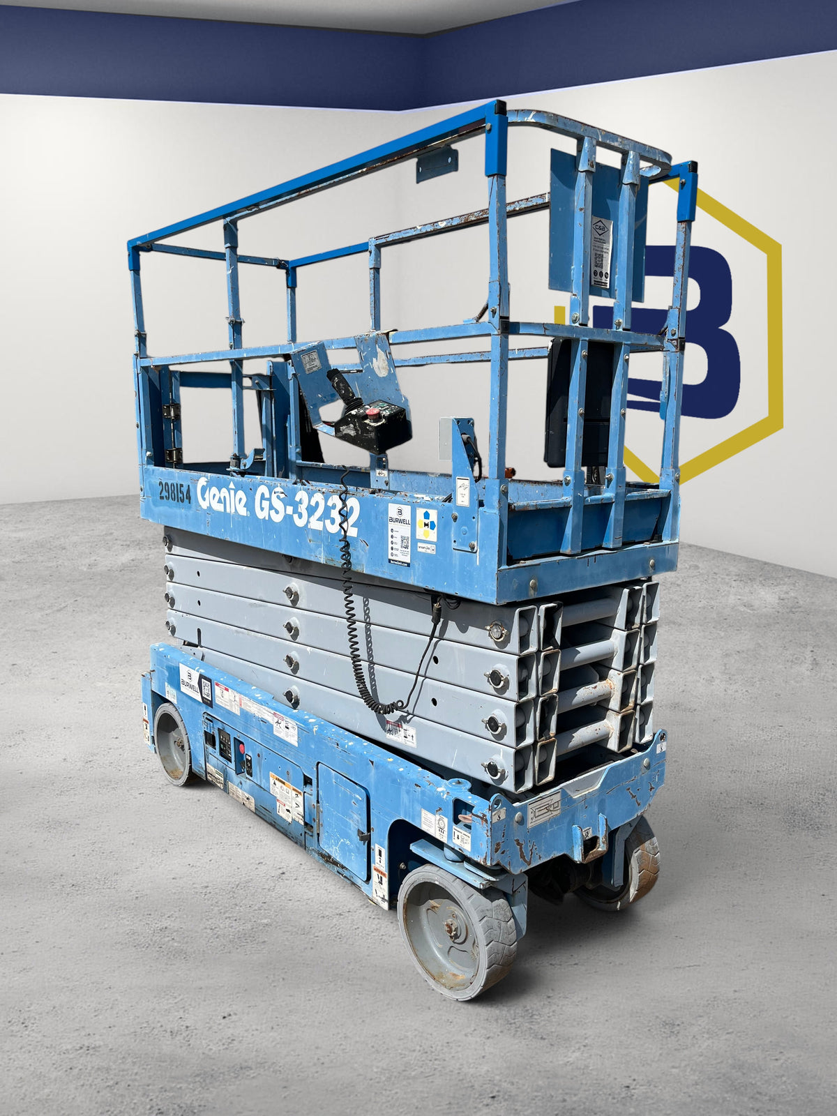 Burwell Material Handling 2013 Genie GS-3232 electric scissor lift with blue frame and 32-foot platform height.