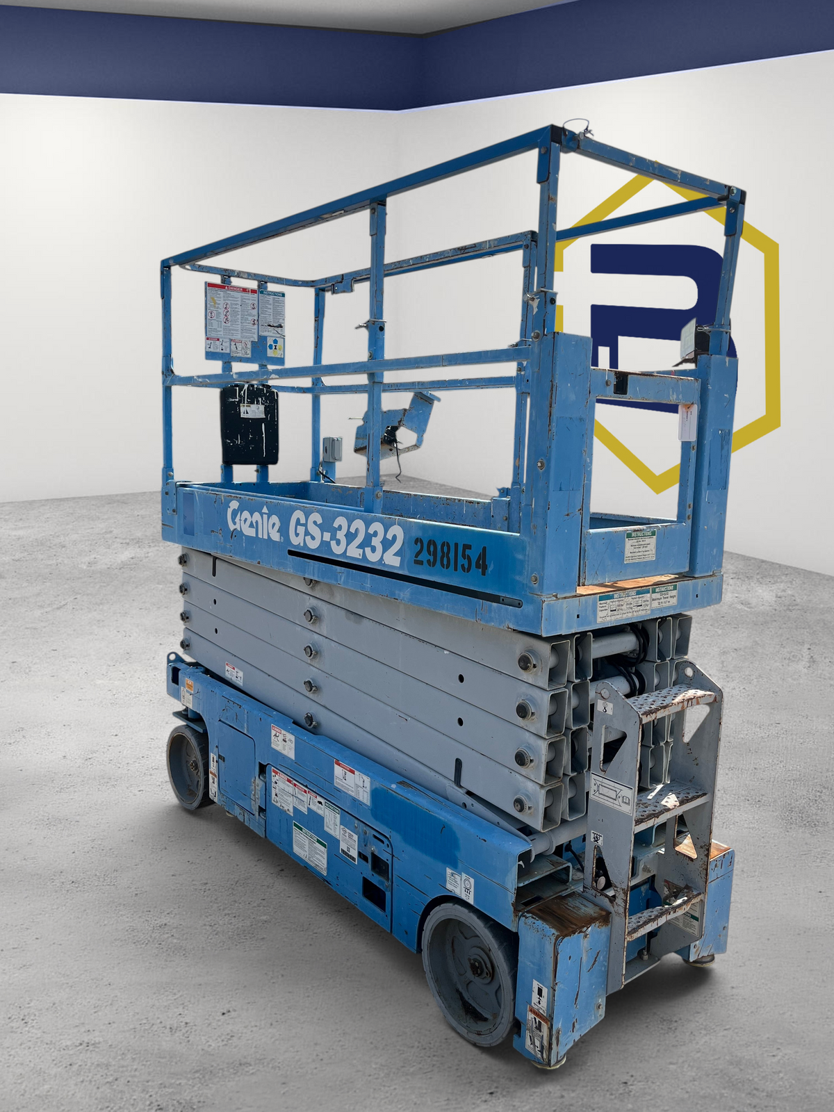 Burwell Material Handling 2013 Genie GS3232 electric scissor lift in blue, parked on a gravel lot.