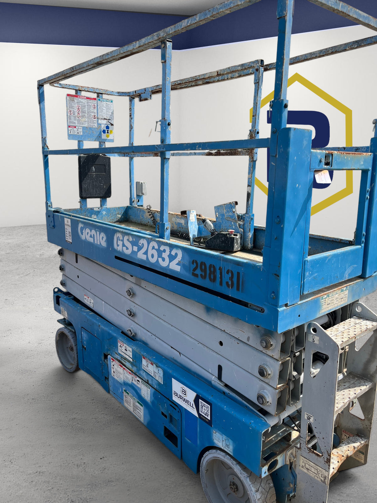 Burwell Material Handling 2013 Genie GS-2632 electric scissor lift in blue, featuring a 26 ft platform height.