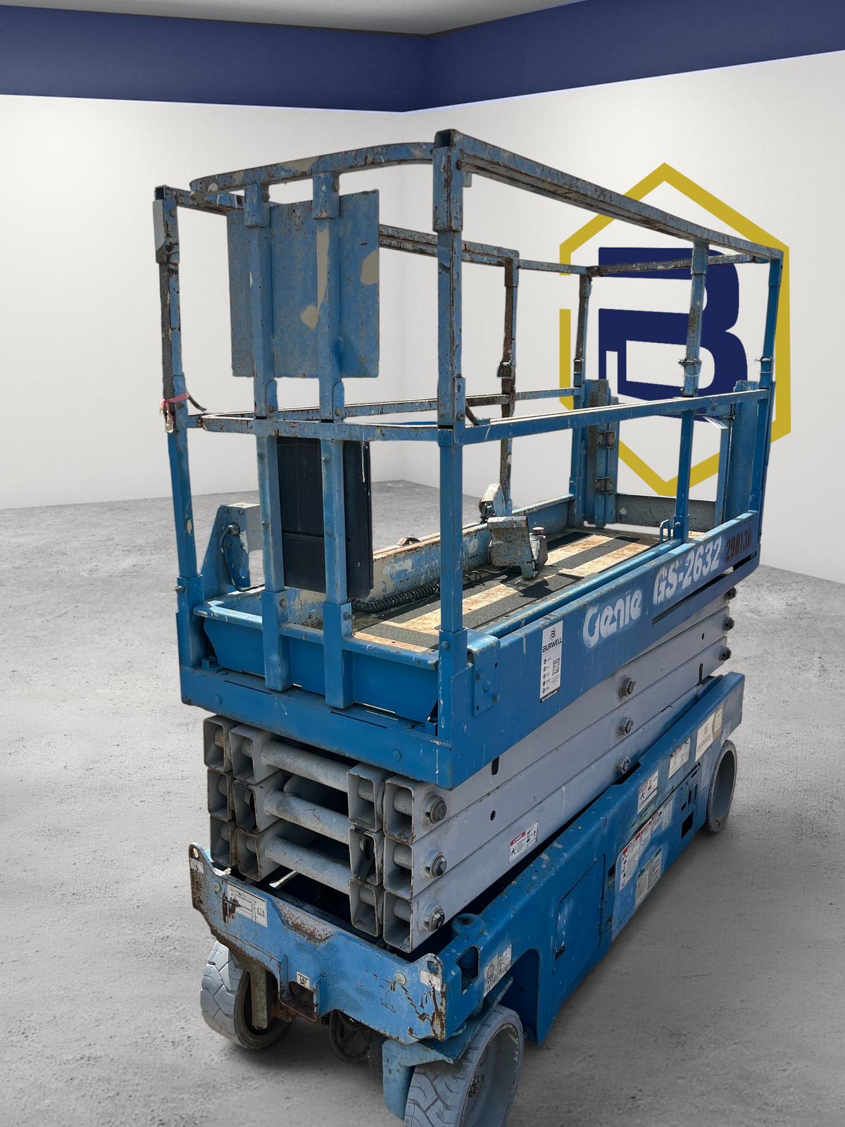 Burwell Material Handling used 2013 Genie GS2632 electric scissor lift in blue, parked on a gravel lot.