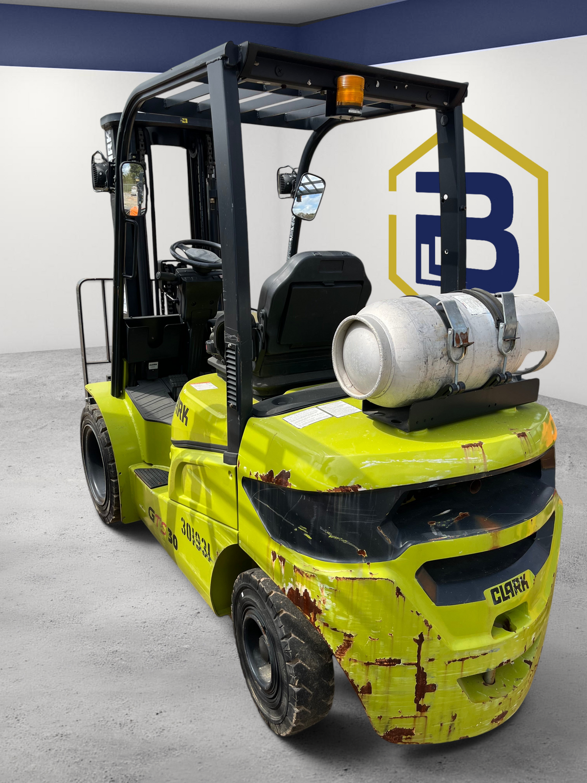 Burwell Material Handling 2022 CLARK GTS30 pneumatic tire forklift in lime green with rear LPG tank in outdoor yard