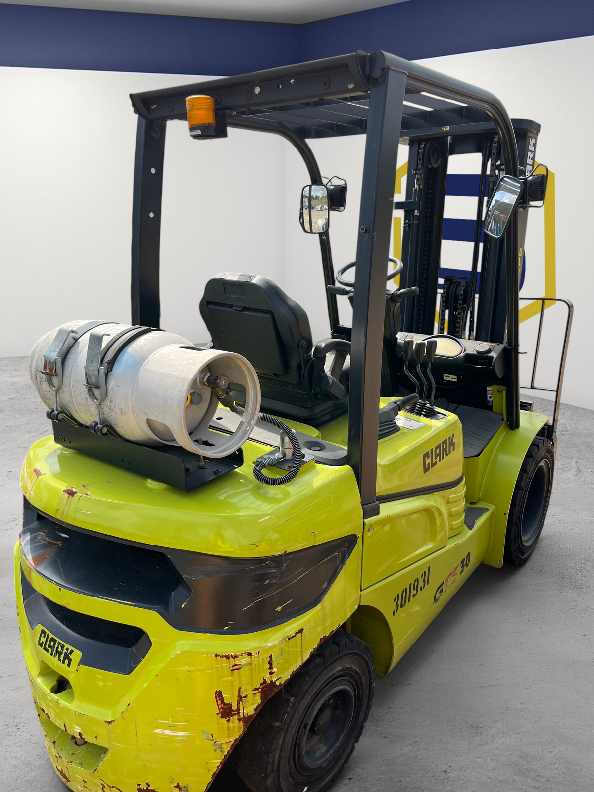 Burwell Material Handling 2022 CLARK GTS30 pneumatic-tire forklift in lime green with an LPG tank in an outdoor yard.