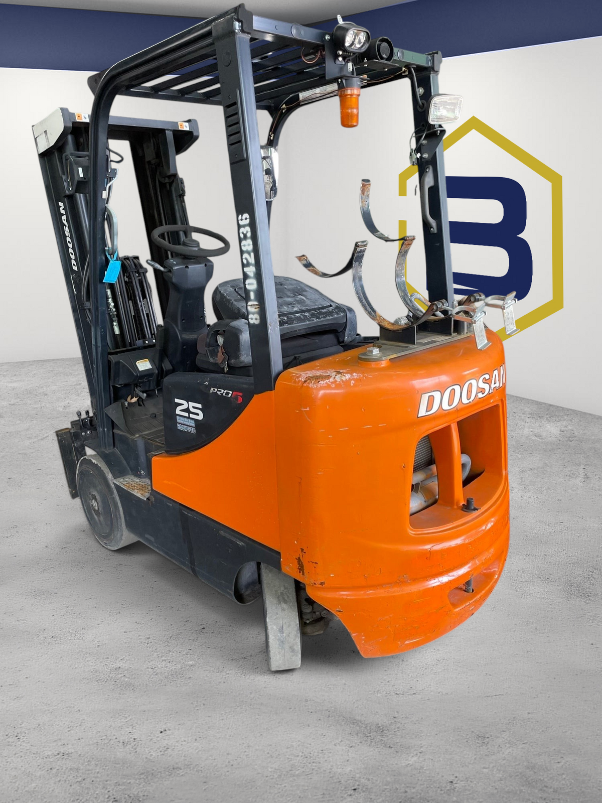 Burwell Material Handling 2017 Doosan GC25P-5 LPG cushion tire forklift in orange and black parked in a warehouse.