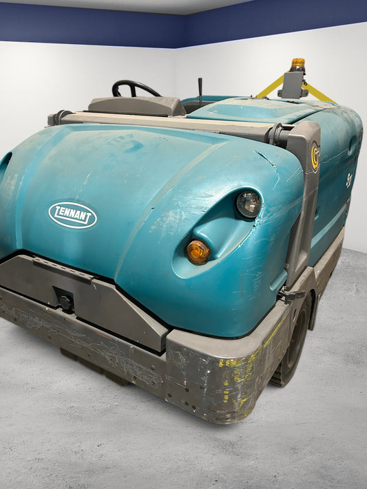 Burwell Material Handling 2000 Tennant S30 industrial rider sweeper in teal with heavy-duty steel frame