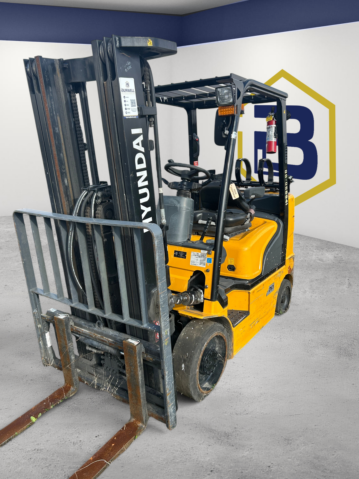 Burwell Material Handling 2019 Hyundai 25LC-7A yellow LPG cushion tire forklift with wide-view mast in outdoor yard