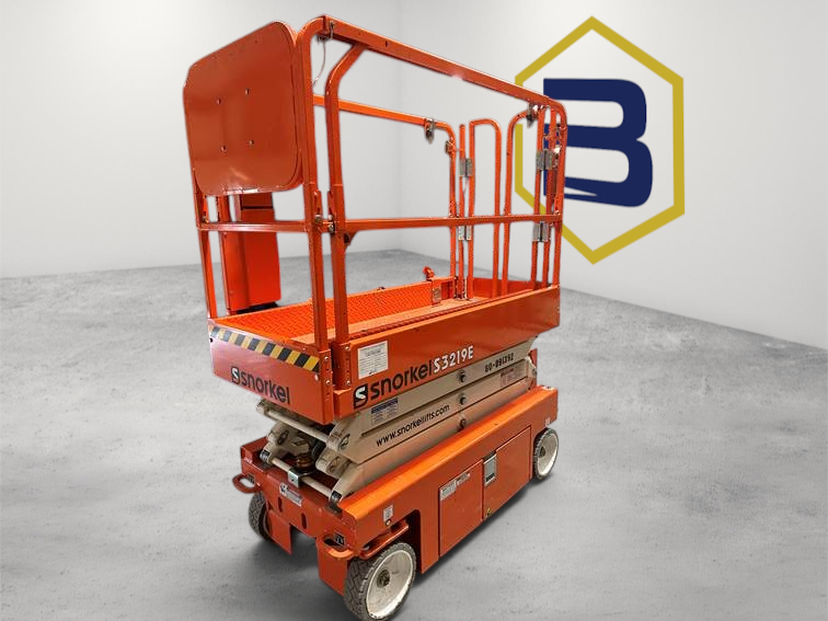 Burwell Material Handling 2022 Snorkel S3219E electric scissor lift in orange, parked inside a warehouse facility.