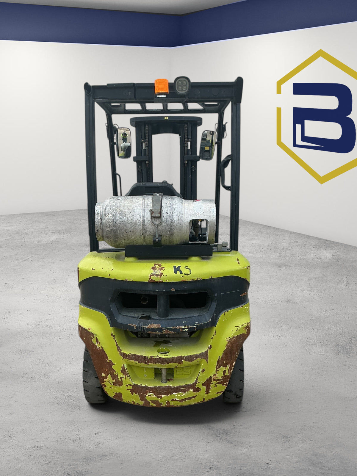 Burwell Material Handling 2014 CLARK S25 forklift with yellow chassis and rear LPG tank in a studio setting
