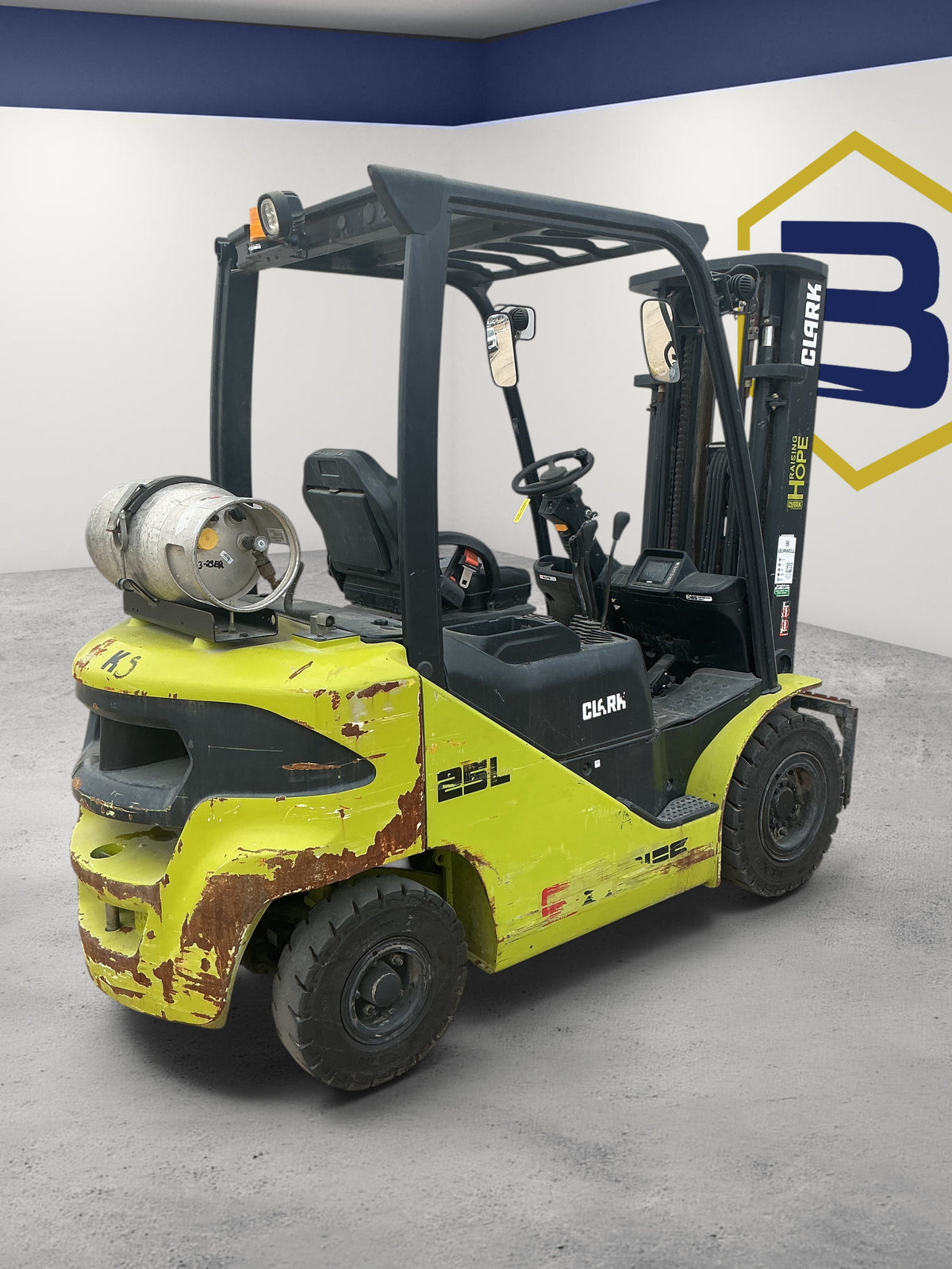 Burwell Material Handling 2014 CLARK S25 pneumatic tire forklift with LPG tank in a warehouse setting