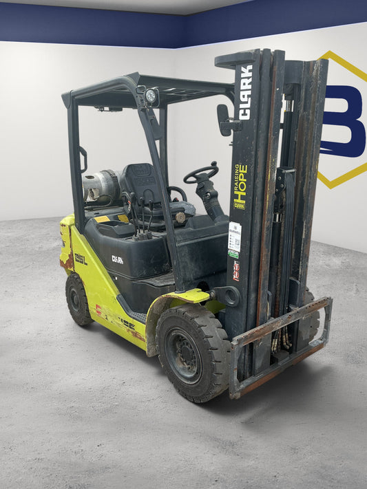 Burwell Material Handling 2014 CLARK S25 pneumatic-tire forklift with yellow and black finish in an indoor warehouse
