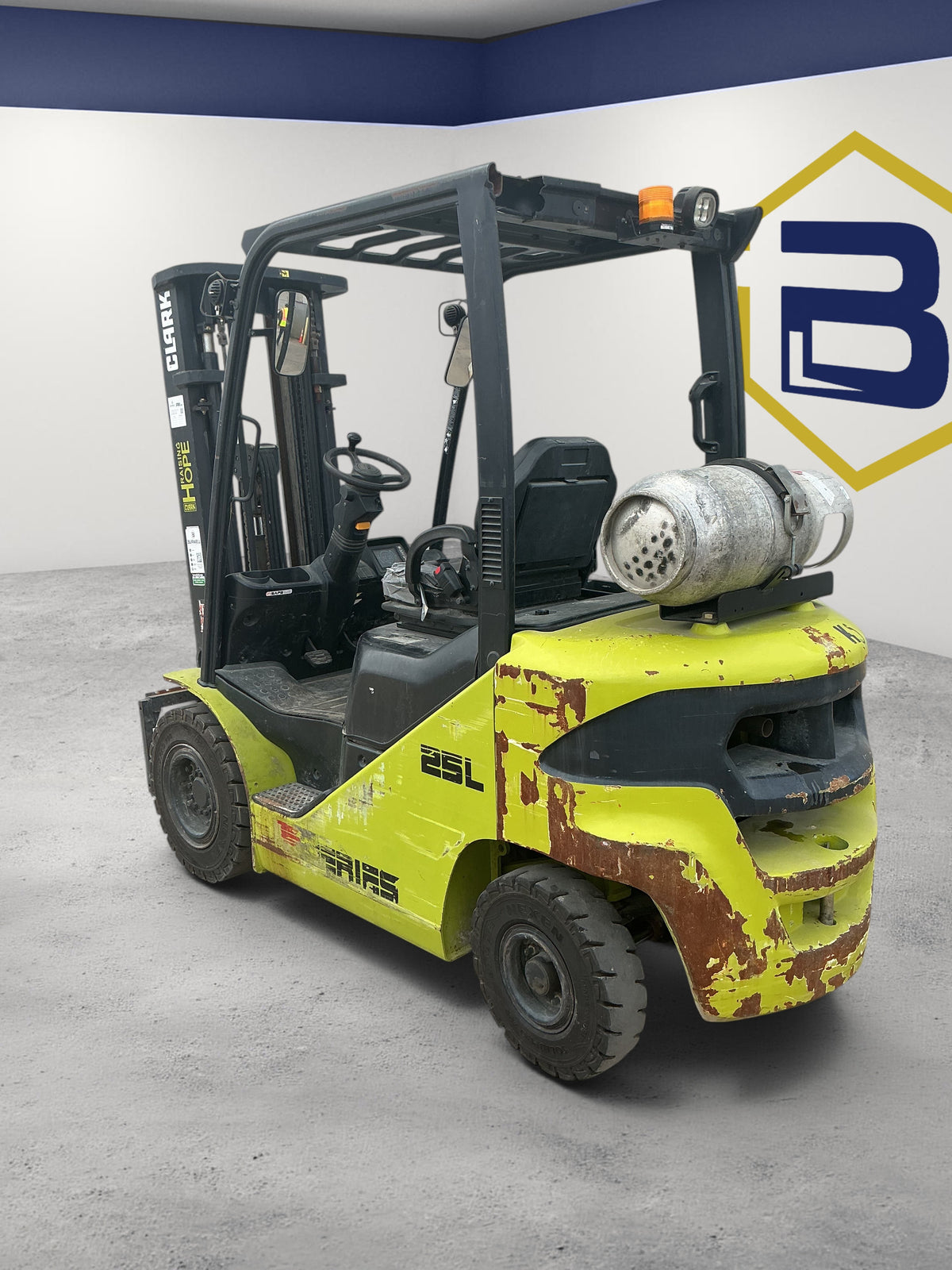 Burwell Material Handling 2014 CLARK S25 5,000 lb pneumatic-tire forklift with yellow chassis and LPG tank
