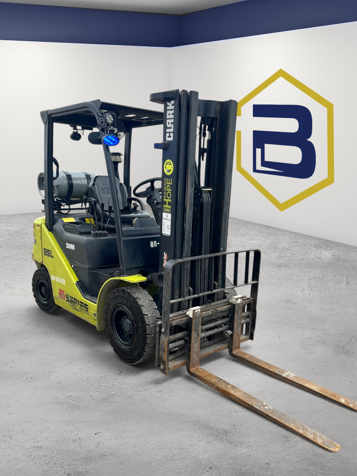 Burwell Material Handling 2020 CLARK S25 LPG forklift with pneumatic tires and triple-stage mast in a warehouse