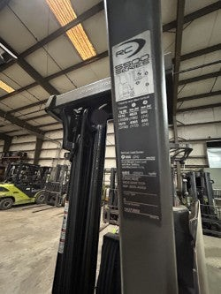 Burwell Material Handling 2011 Crown RC5545-40 forklift mast with capacity specification plate in a warehouse