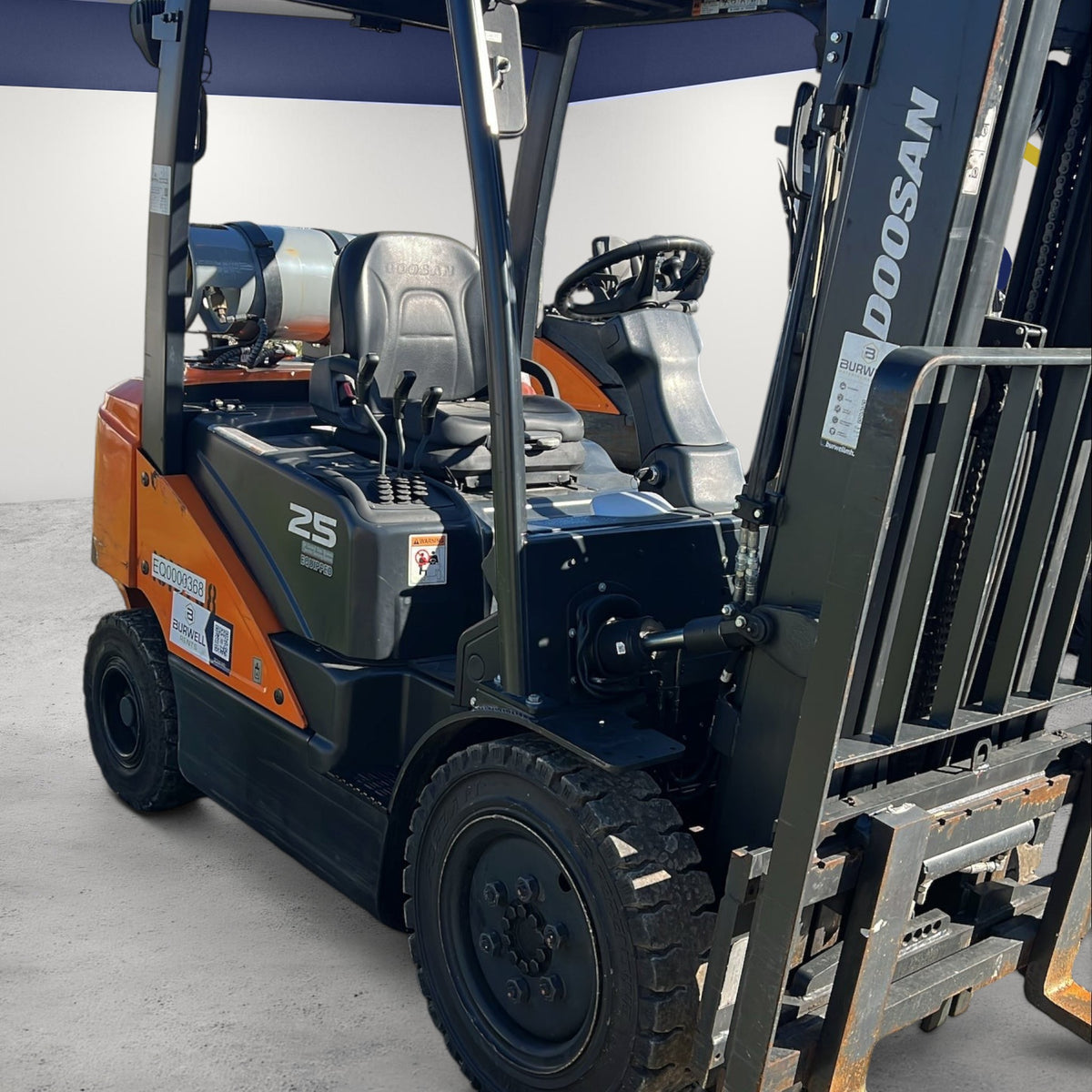Burwell Material Handling 2020 Doosan G25N-7LP LPG pneumatic forklift with orange and black finish.