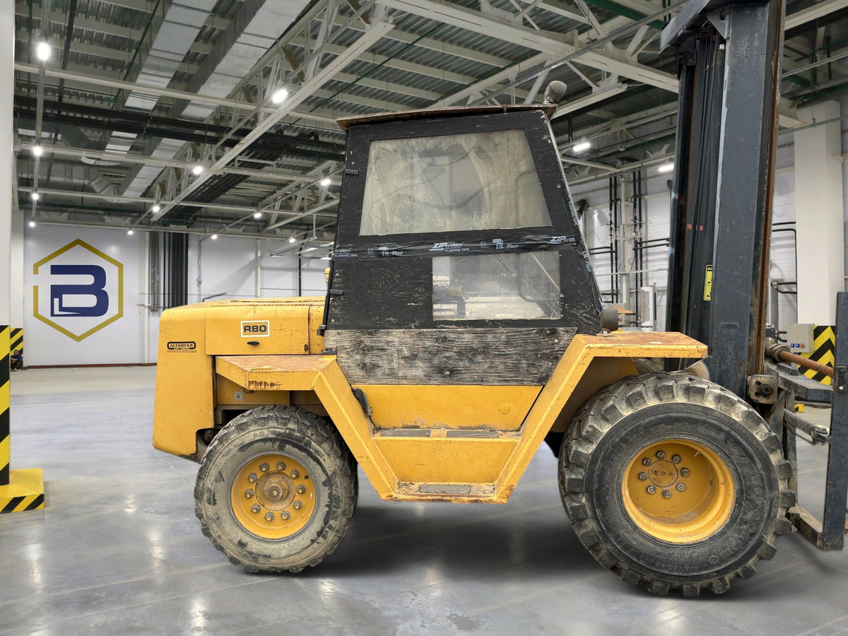 Burwell Material Handling 1996 Eagle Picher R80-F11 yellow rough terrain forklift with enclosed cab
