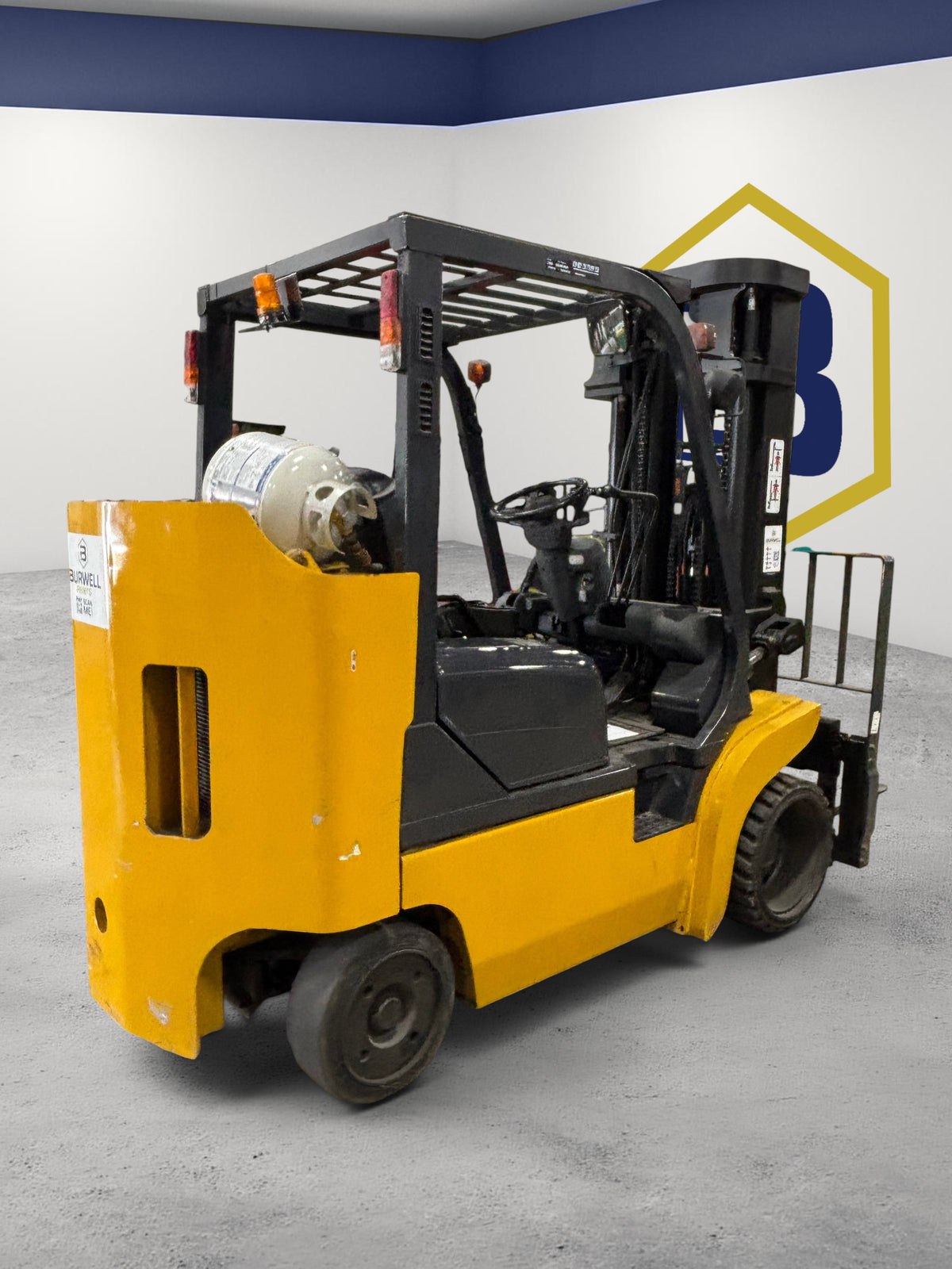 Burwell Material Handling 2001 Komatsu FG45BCS-7 yellow and black LPG cushion-tire forklift for indoor industrial use