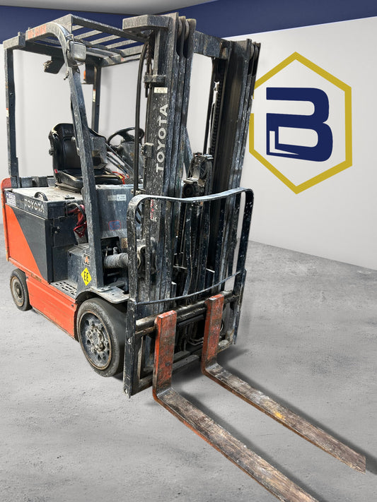 Burwell Material Handling 2011 Toyota 8FBCU25 electric cushion forklift with 5,000 lb capacity in a warehouse setting.